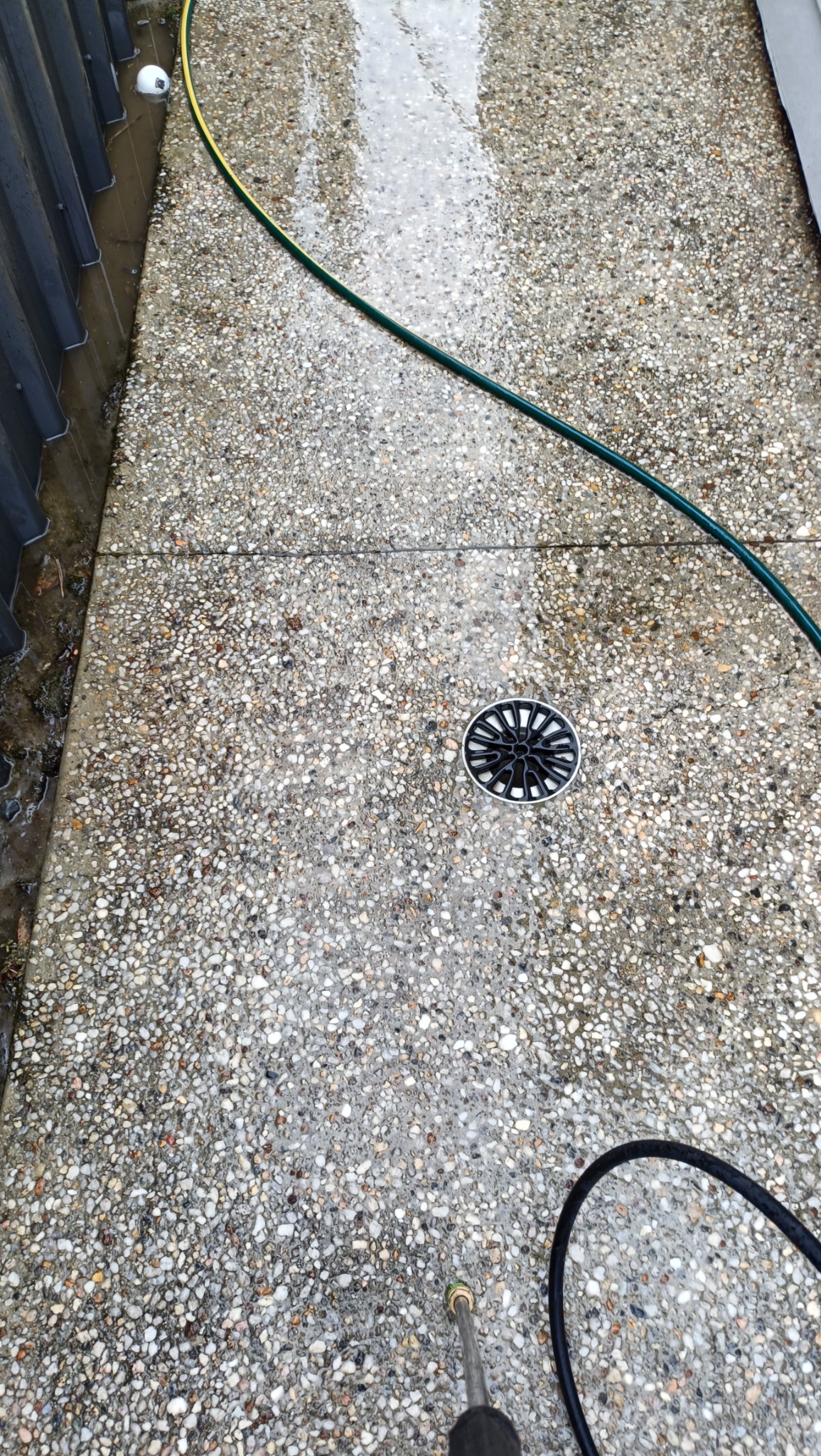 Pressure washing around pathway drain thumbnail